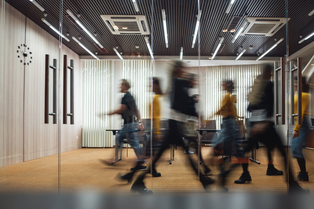 Timelapse of employees walking in a busy startup